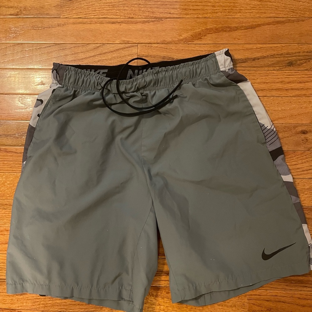 Nike Athletic Shorts. Dri Fit material. Similar to swim trunks. Gray. XL